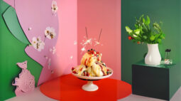 Pavlova Meringue Eton Mess, covered in condiments and berries with sparkles. Image by Charles Malene for MoodyEater™