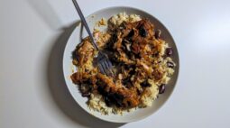 Brown Stewed Chicken on Rice and Peas partially eaten. Photo by Charles Malene for MoodyEater™