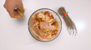 Stew Chicken in 24H marinade with thyme and bay leaves. Photo by Charles Malene for MoodyEater™