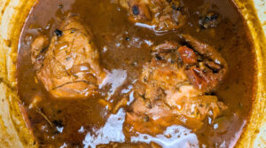 Brown Stewed Chicken recipe test final step of cooking chicken in stewed sauce. Photo by Charles Malene for MoodyEater™