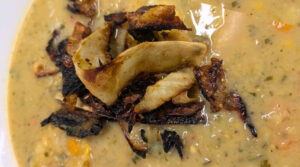 Révolution Réchauffé 01: Close-up of Crispy Curry Cabbage Topper with Trini Corn soup. Photo by Charles Malene for MoodyEater™