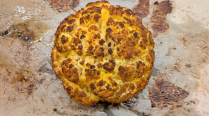 Beautiful shot of roasted cauliflower fresh out the oven on a baking tray. Photo by Charles Malene for MoodyEater™