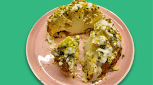 Half eaten Roasted Cauliflower florets with Sunflower Miso Tahini covered in crushed pistachios, mint and parsley. Photo by Charles Malene for MoodyEater™