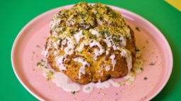 Delicious Roasted Cauliflower with Sunflower Miso Tahini covered in crushed pistachios, mint and parsley. Photo by Charles Malene for MoodyEater™