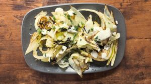 Overhead shot of Ottolenghi's Roasted Cabbage with Sunflower Tahini recipe test. Photo by Charles Malene for MoodyEater™