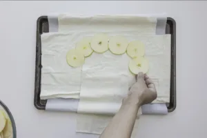 Apples slices placed on pastry. Photo by Charles Malene for MoodyEater™
