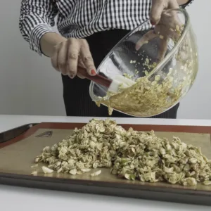 Spread granola onto the baking mat and tray. Photo by Charles Malene for MoodyEater™