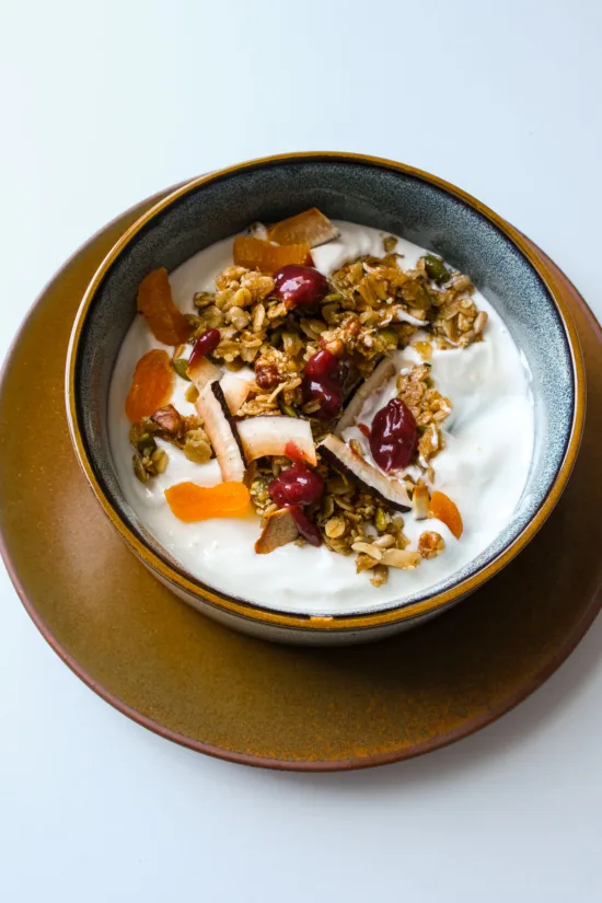 Close-up of Café Cecilia Granola with DIY yogurt, berry jam and poached apricots. Photo by Charles Malene for MoodyEater™