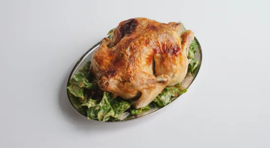 Cafe Cecilia's Roast Chicken with Datterini Tomatoes, Baby Gem, and Aioli Salad partially eaten. Photo by Charles Malene for MoodyEater™
