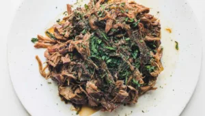 Shredded soy-braised beef chuck topped with herbs. Photo by Charles Malene for MoodyEater™