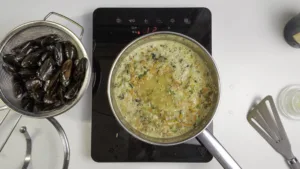 Champagne Moules Frites (mussels and fries). Step-4: add champagne to mirepoix. Photo by Charles Malene for MoodyEater™