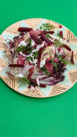 Radicchio Beet & Walnut Salad on a green background. Photo by Charles Malene for MoodyEater™