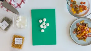 Pearl mozzarella on the cutting board. Photo by Charles Malene for MoodyEater™