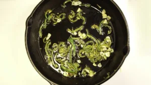 Sauté Calabrian chiles and garlic in olive oil. Photo by Charles Malene for MoodyEater™